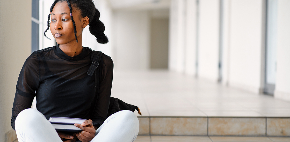 Student sitting on steps